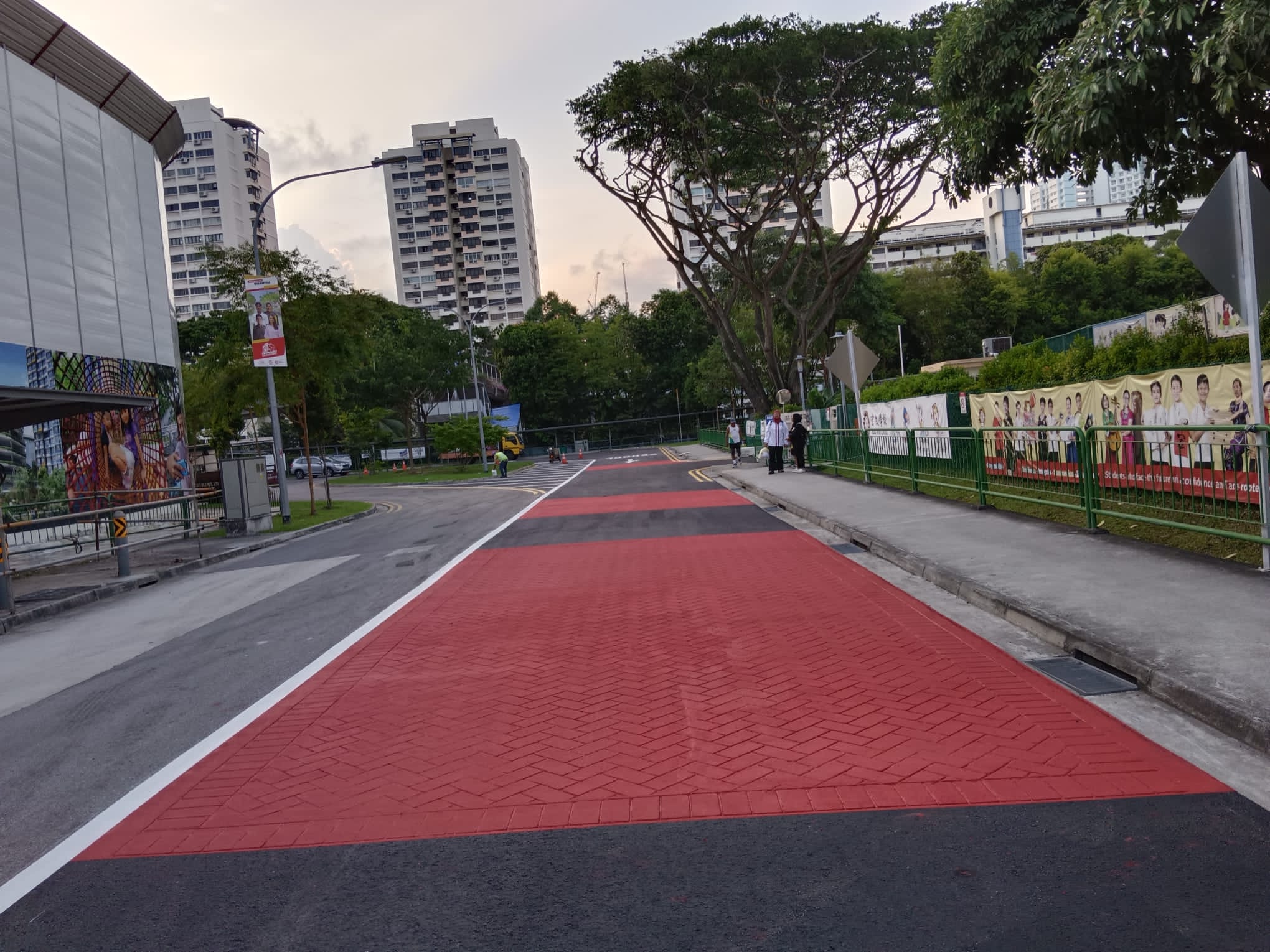 Completed red and black herringbone asphalt imprint footpath by EMK Construction