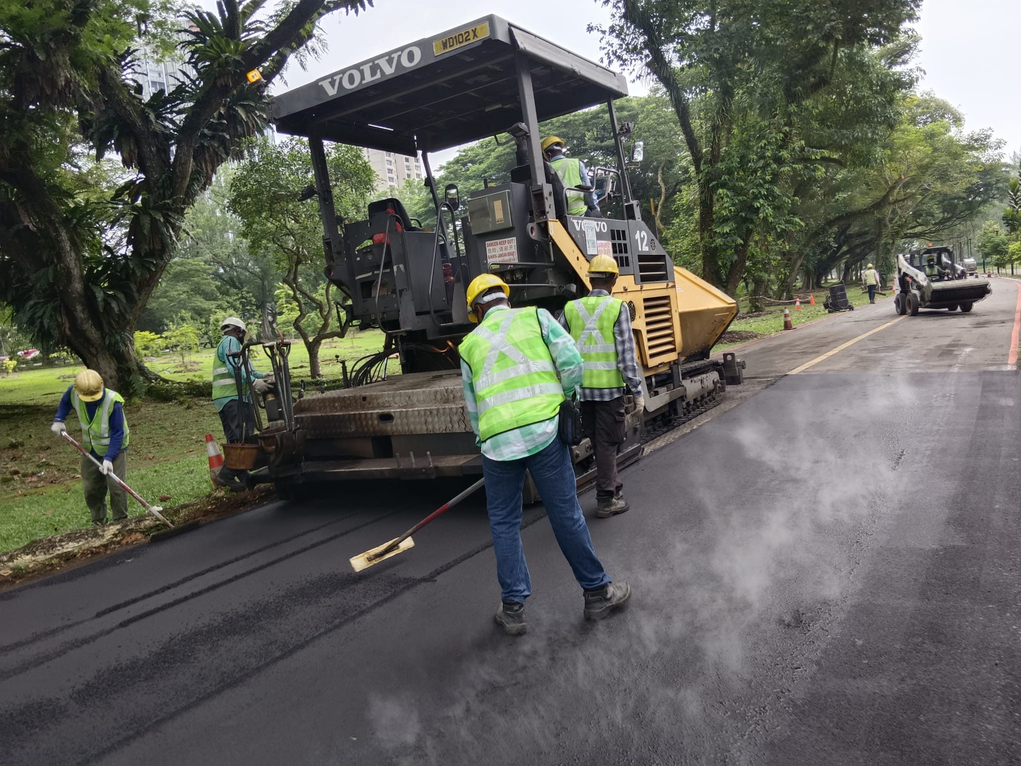 Asphalt resurfacing works in progress with paver machine by EMK Construction